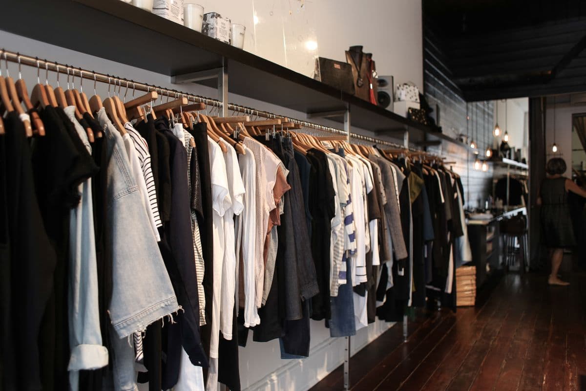 Clothing displayed on racks inside a shop